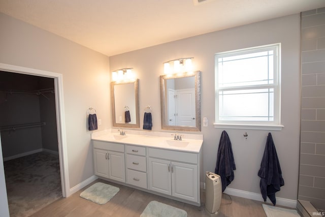 bathroom with vanity and wood-type flooring