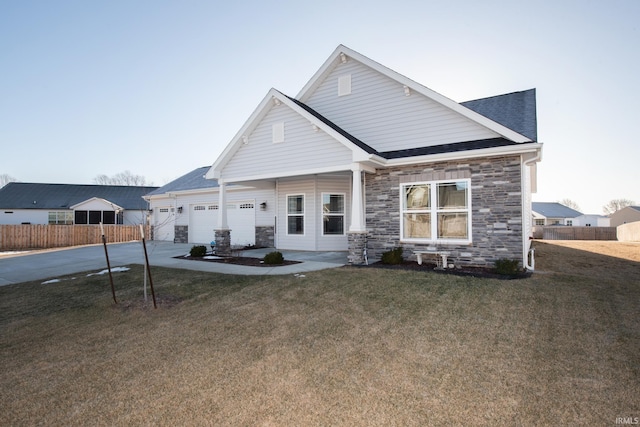 craftsman-style house featuring a garage and a front yard