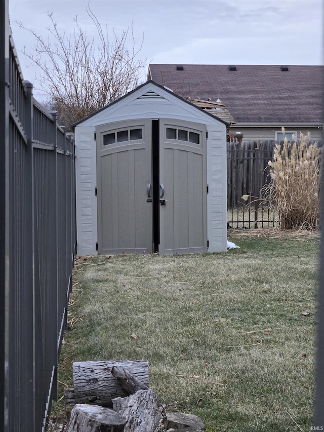 view of outbuilding with a lawn