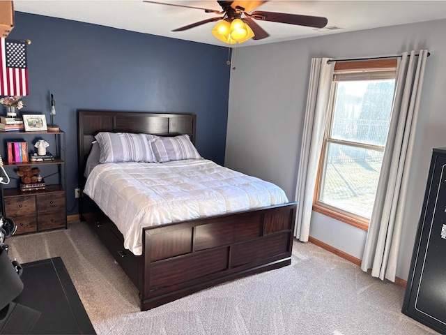 bedroom with light colored carpet and ceiling fan