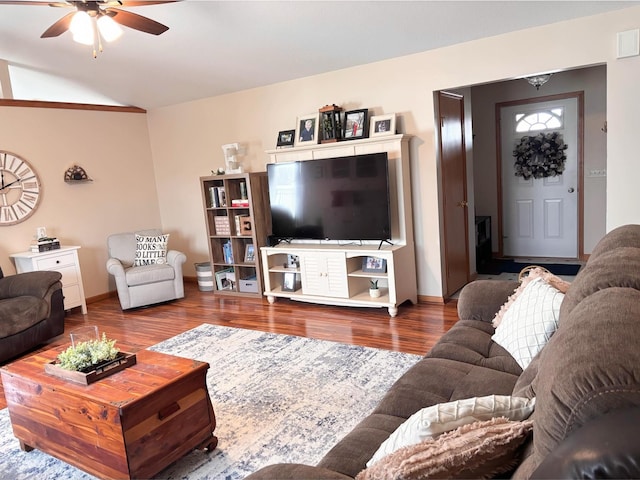 living room featuring hardwood / wood-style flooring, ceiling fan, and lofted ceiling