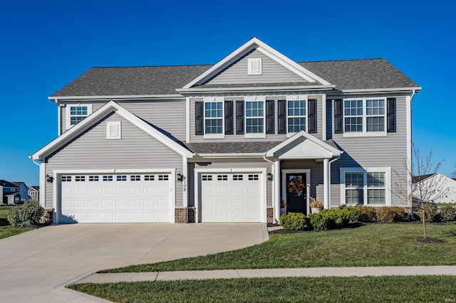 view of front facade with a garage and a front yard