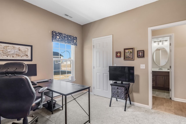 office area with light carpet