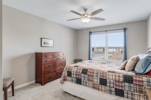 bedroom featuring ceiling fan and light colored carpet