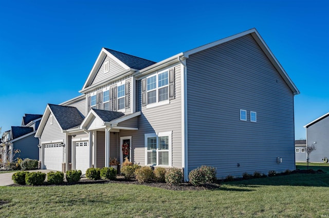 view of front of home with a garage and a front lawn