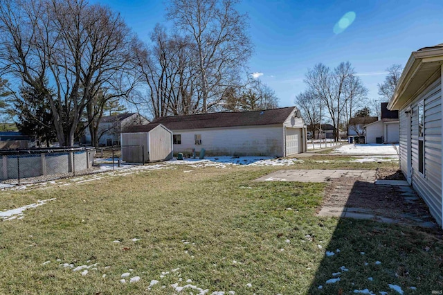 view of yard with a storage shed and a garage