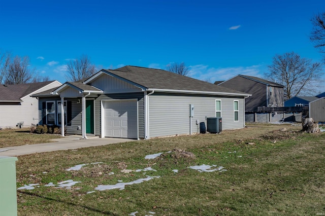 view of side of property with a yard and a garage