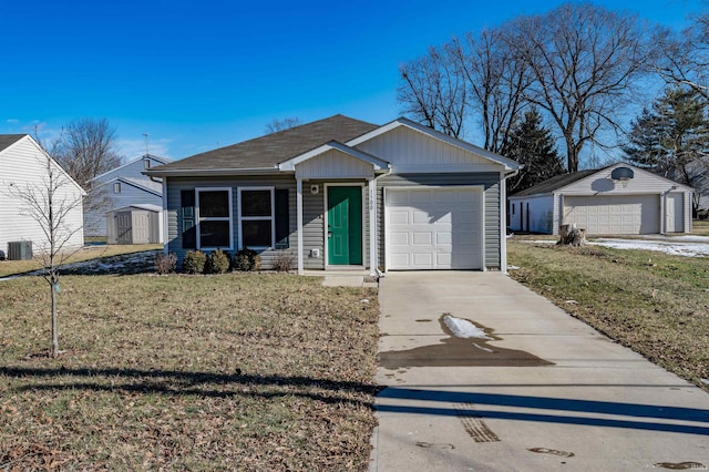 view of front of property featuring a storage shed, a garage, and a front yard