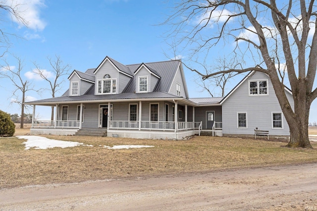 country-style home featuring covered porch and a front lawn