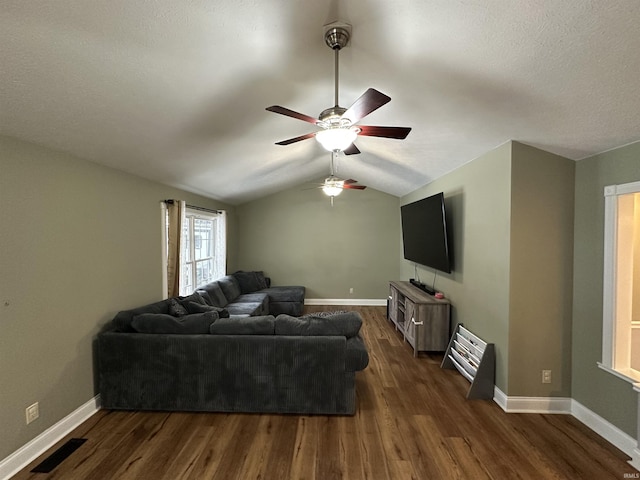 living room with vaulted ceiling, dark wood-type flooring, and ceiling fan