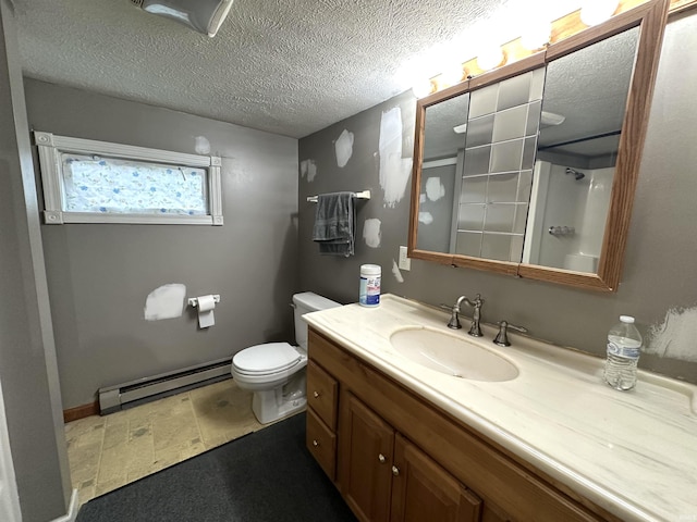 bathroom with toilet, a shower, a textured ceiling, baseboard heating, and vanity