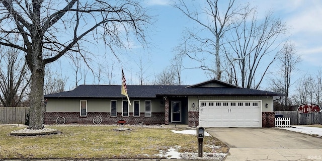 ranch-style home with a garage and a front lawn