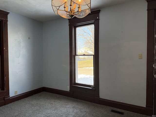 interior space with plenty of natural light and a chandelier