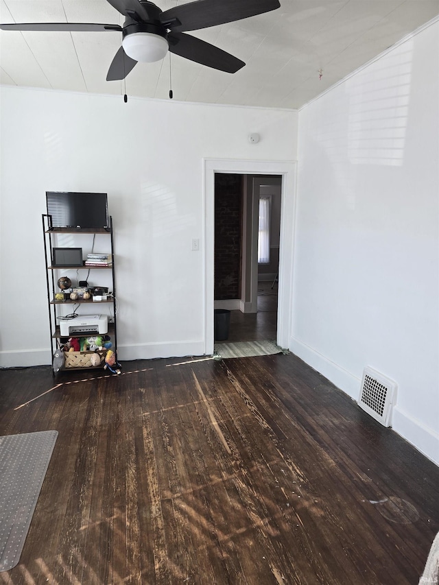 empty room with hardwood / wood-style flooring and ceiling fan