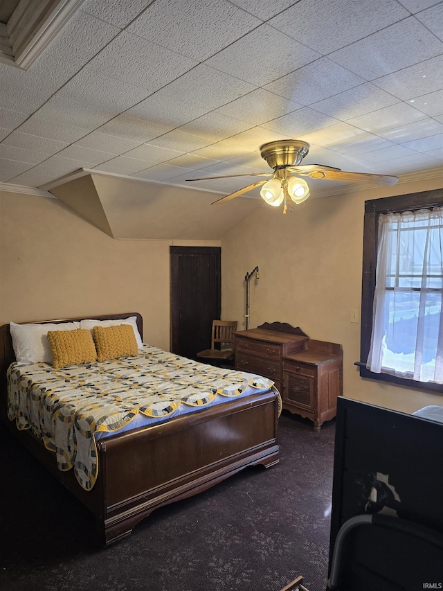 bedroom with ceiling fan and dark colored carpet