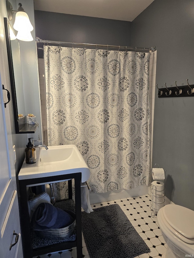 full bathroom featuring vanity, shower / bath combination with curtain, and toilet