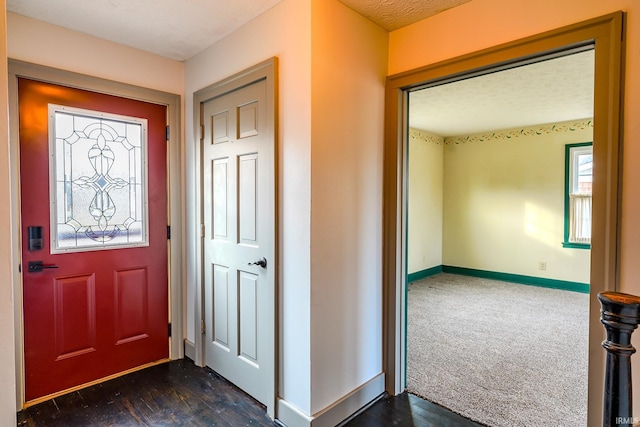 view of carpeted foyer