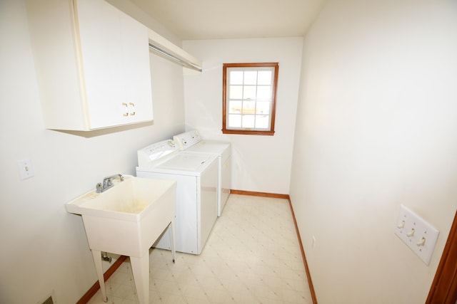 clothes washing area with washer and clothes dryer