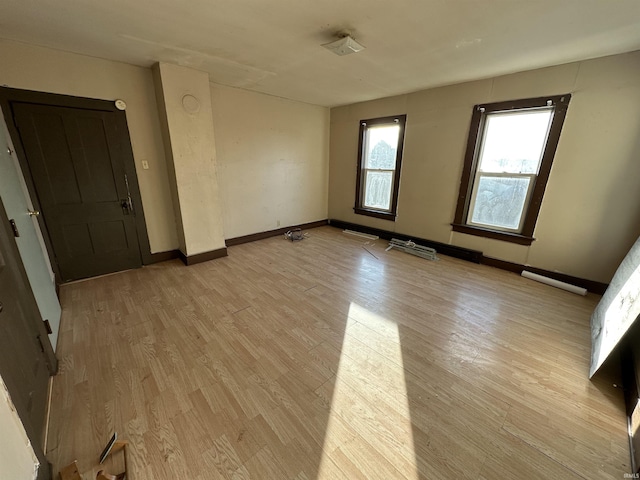 unfurnished room featuring light wood-type flooring