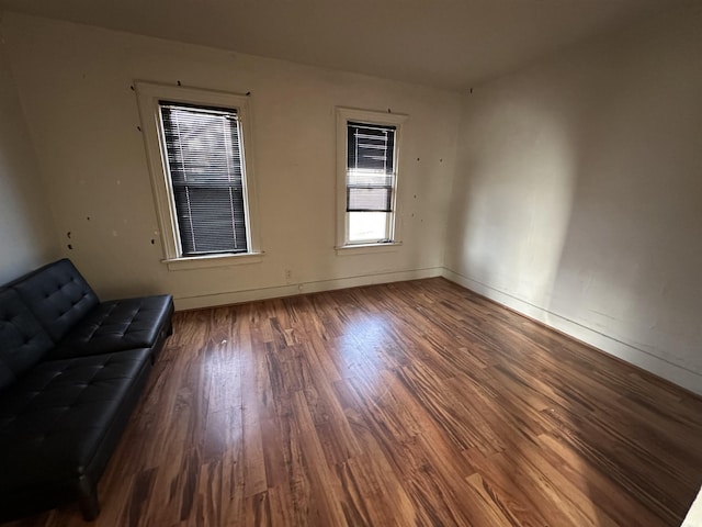 spare room featuring dark hardwood / wood-style floors