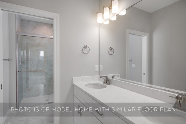 bathroom featuring vanity and a shower with door