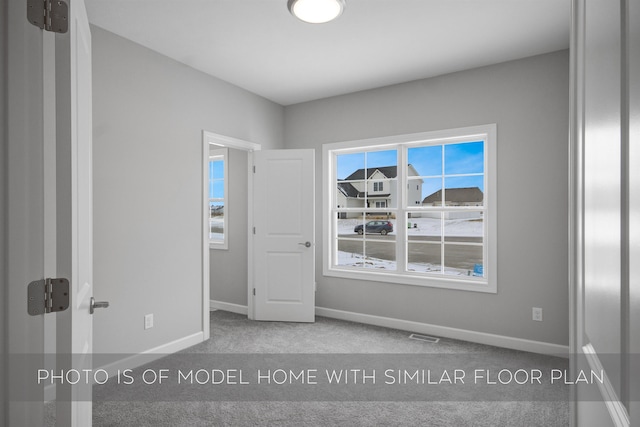 unfurnished bedroom with carpet floors