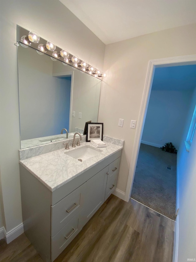 bathroom featuring vanity and hardwood / wood-style flooring