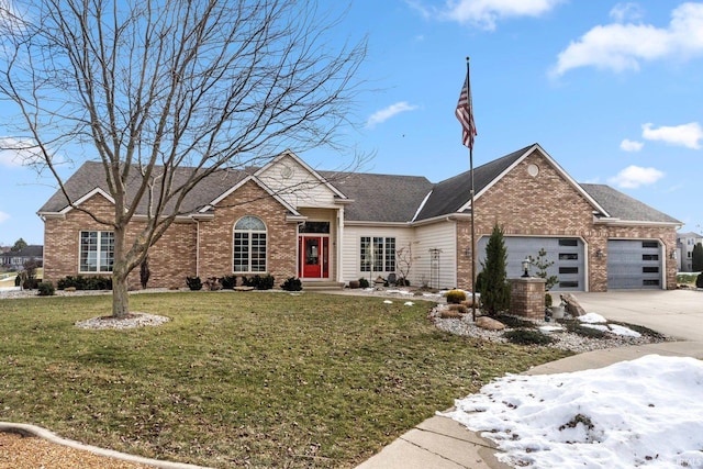 view of front of home featuring a garage and a front yard