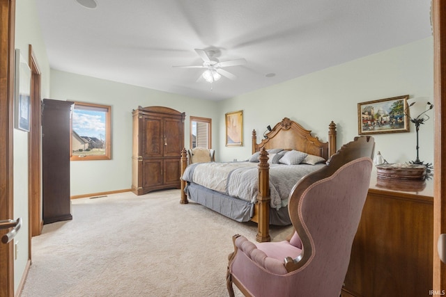 bedroom featuring light carpet and ceiling fan