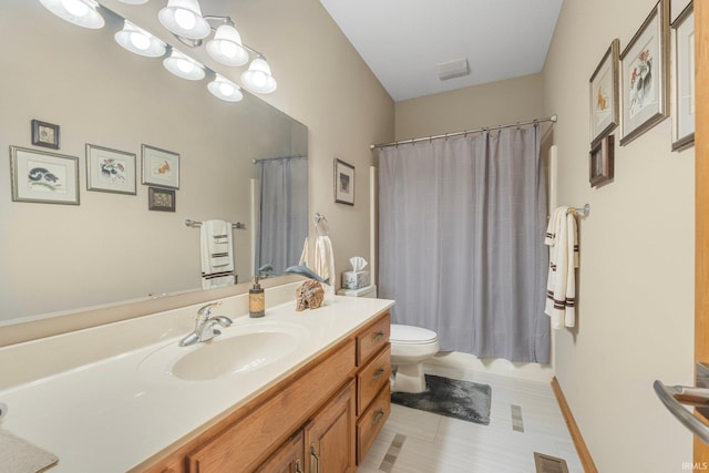 full bathroom with vanity, shower / bath combo with shower curtain, and toilet