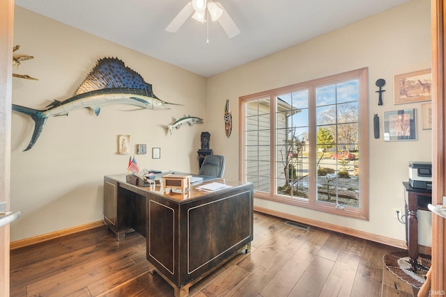 office space with ceiling fan and dark hardwood / wood-style flooring