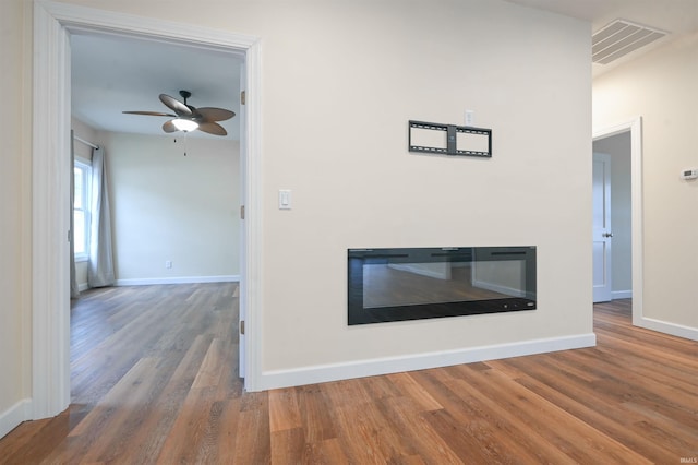 interior details with hardwood / wood-style flooring and ceiling fan