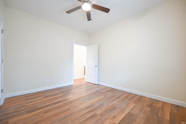 unfurnished room with hardwood / wood-style flooring and ceiling fan