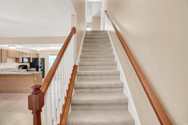 staircase featuring sink