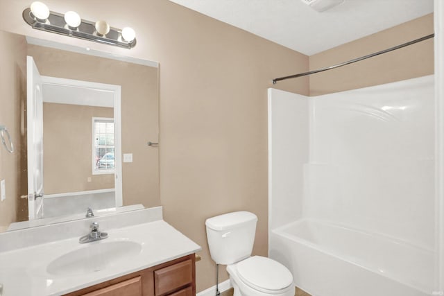 full bathroom with vanity, bathtub / shower combination, and toilet