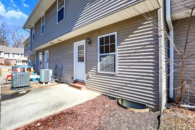 view of home's exterior featuring central AC and a patio area