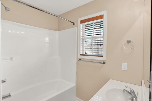 bathroom featuring sink and bathing tub / shower combination