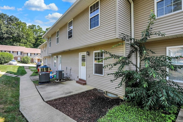 back of property featuring central AC and a patio