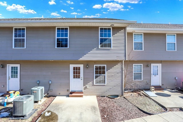 back of house with a patio and central air condition unit