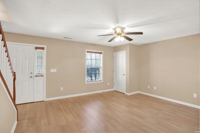 unfurnished room featuring light hardwood / wood-style flooring and ceiling fan