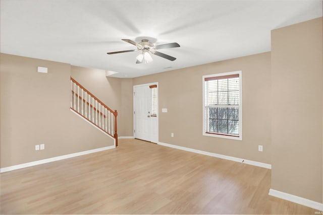 interior space with ceiling fan and light hardwood / wood-style flooring