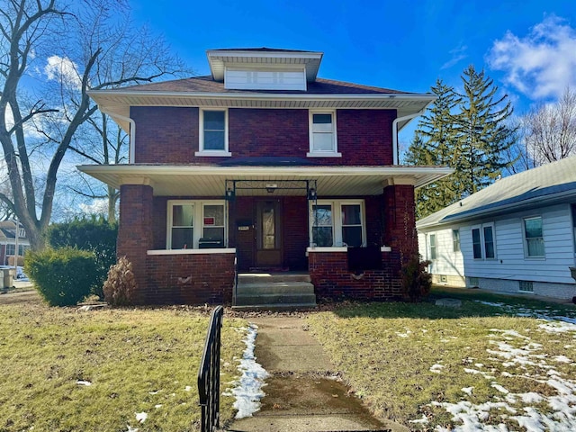 view of front of home featuring a porch and a front yard