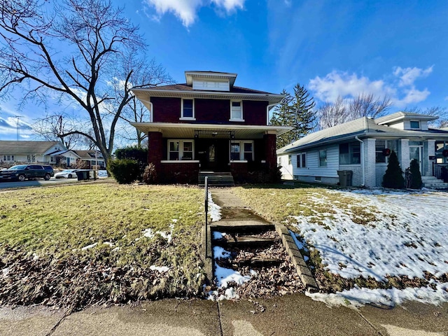 view of front of home featuring a yard and a porch