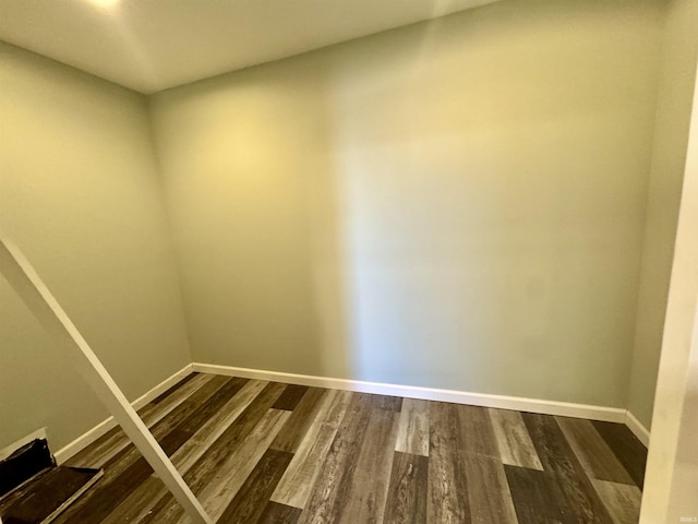 empty room with hardwood / wood-style floors