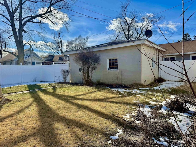 view of home's exterior with a lawn