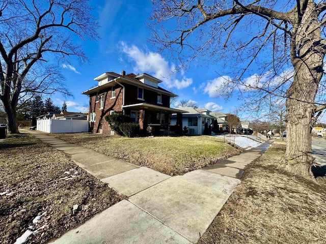 view of side of property with a yard