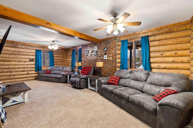 living room featuring beamed ceiling, a wood stove, carpet flooring, log walls, and ceiling fan