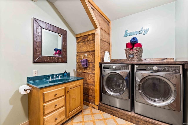 washroom with sink and washer and clothes dryer