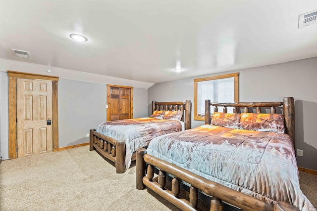 bedroom featuring lofted ceiling and carpet floors