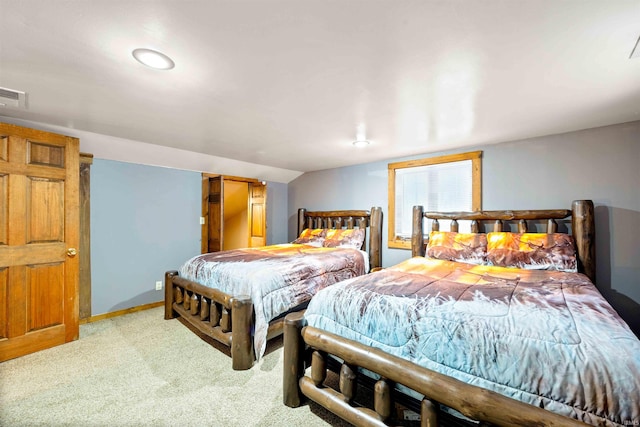 carpeted bedroom featuring lofted ceiling